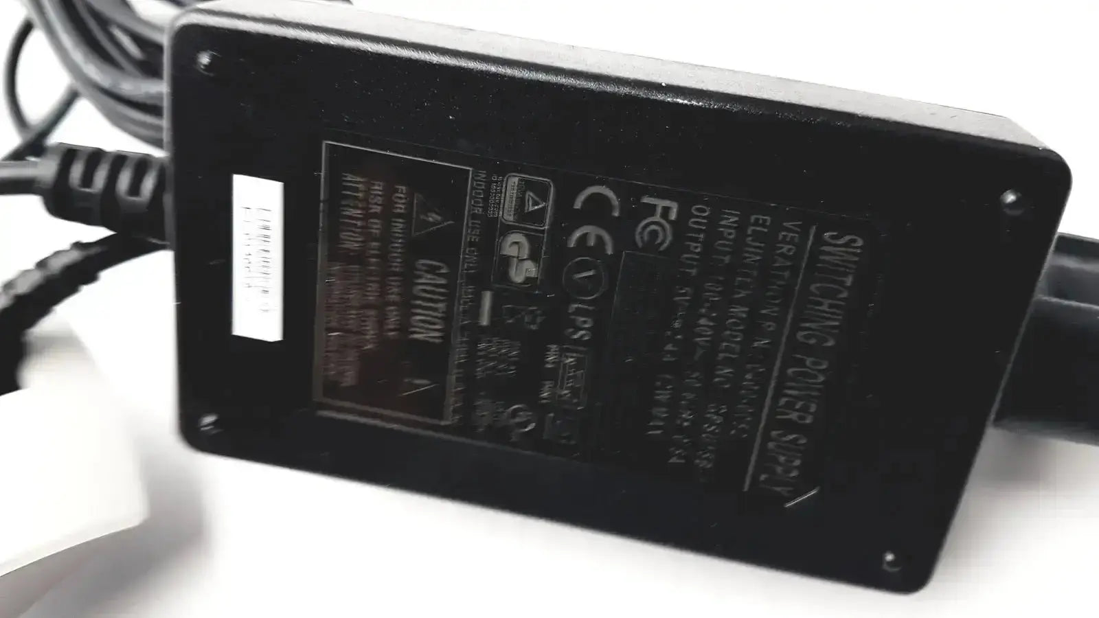 Black rectangular switching power supply with labels on the back for Verathon 0570-0155 BladderScan charging cradle