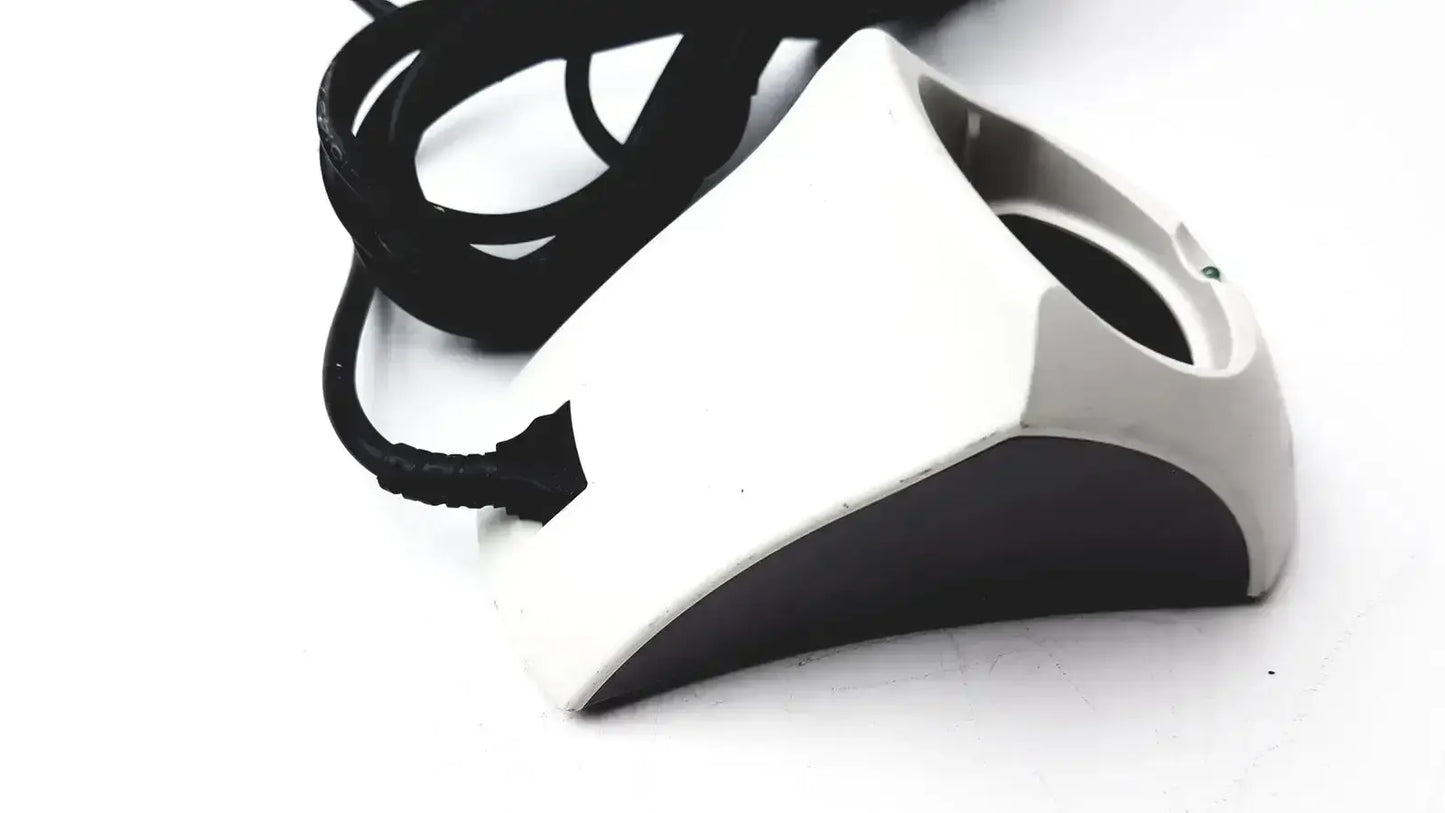 White and black geometric charging cradle with coiled black cable for Verathon 0570-0155 bladderscan charging use