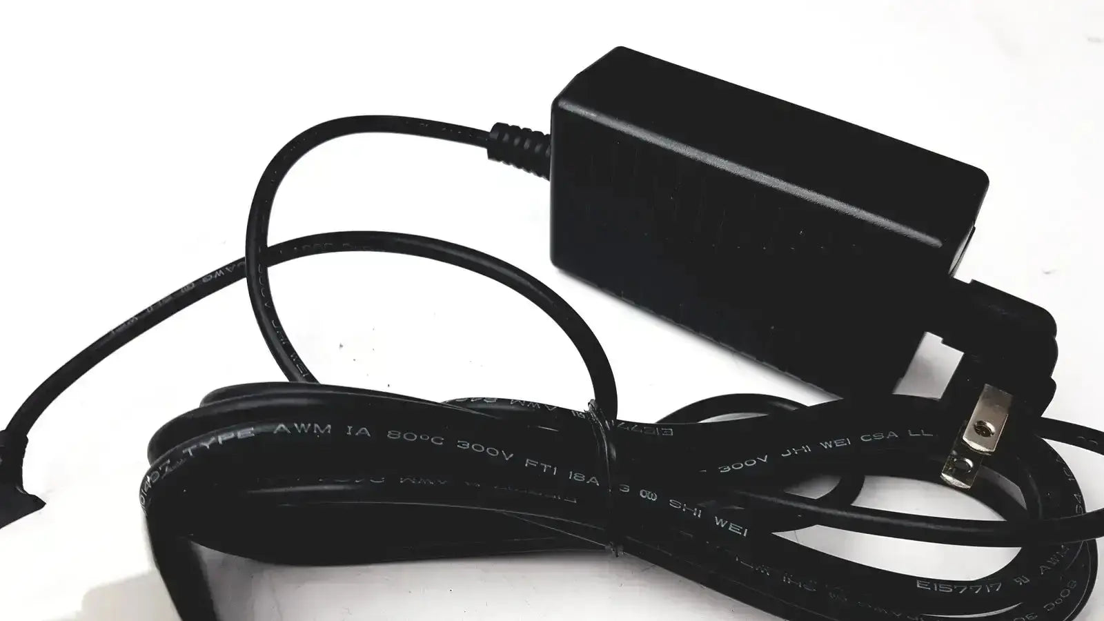 Black plastic power adapter with coiled cable for verathon 0570-0155 bladderscan charging cradle