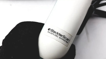 White verathon bladderscan bvi ultrasound device with cylindrical body and black cable for bladder imaging