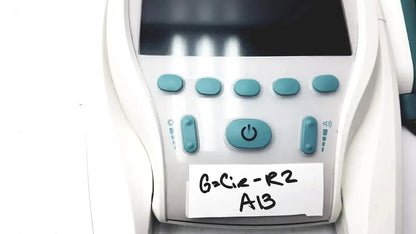 White verathon bladderscan bvi 9400 medical device with teal buttons black screen and handwritten label g-cir-r2 a13