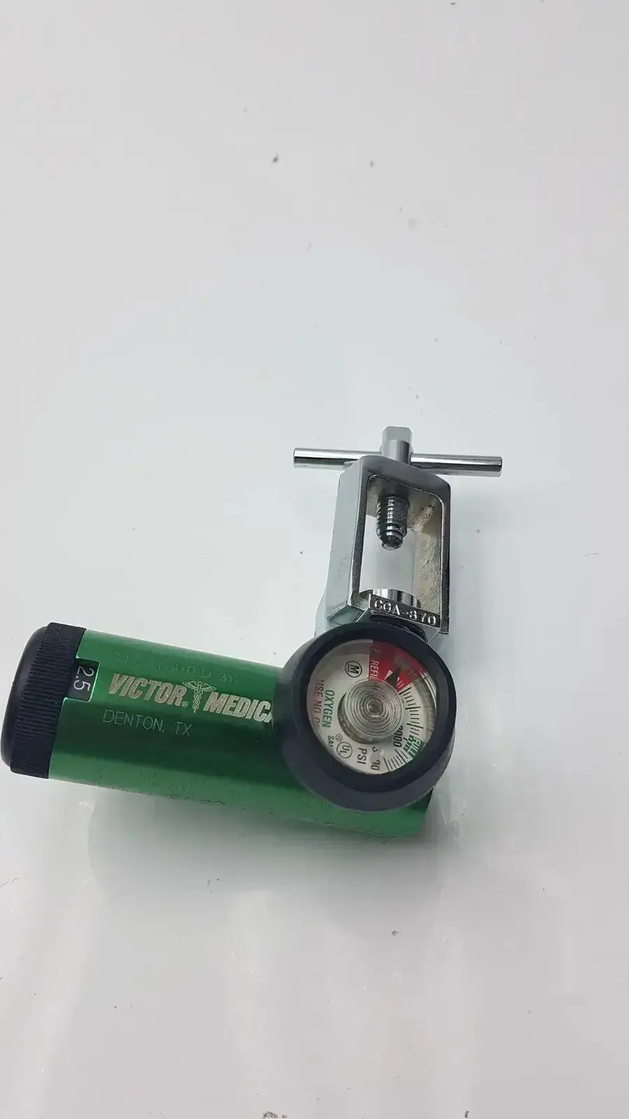 Green victor medical air pressure regulator with silver regulator and black gauge on oxygen cylinder denton tx model fs ii 8y