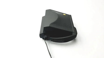 Black plastic vintage polaroid spectra 2 instant film camera with yellow button and black cable extending from side