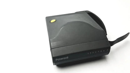 Black polaroid spectra 2 instant film camera with yellow button and black strap vintage untested model