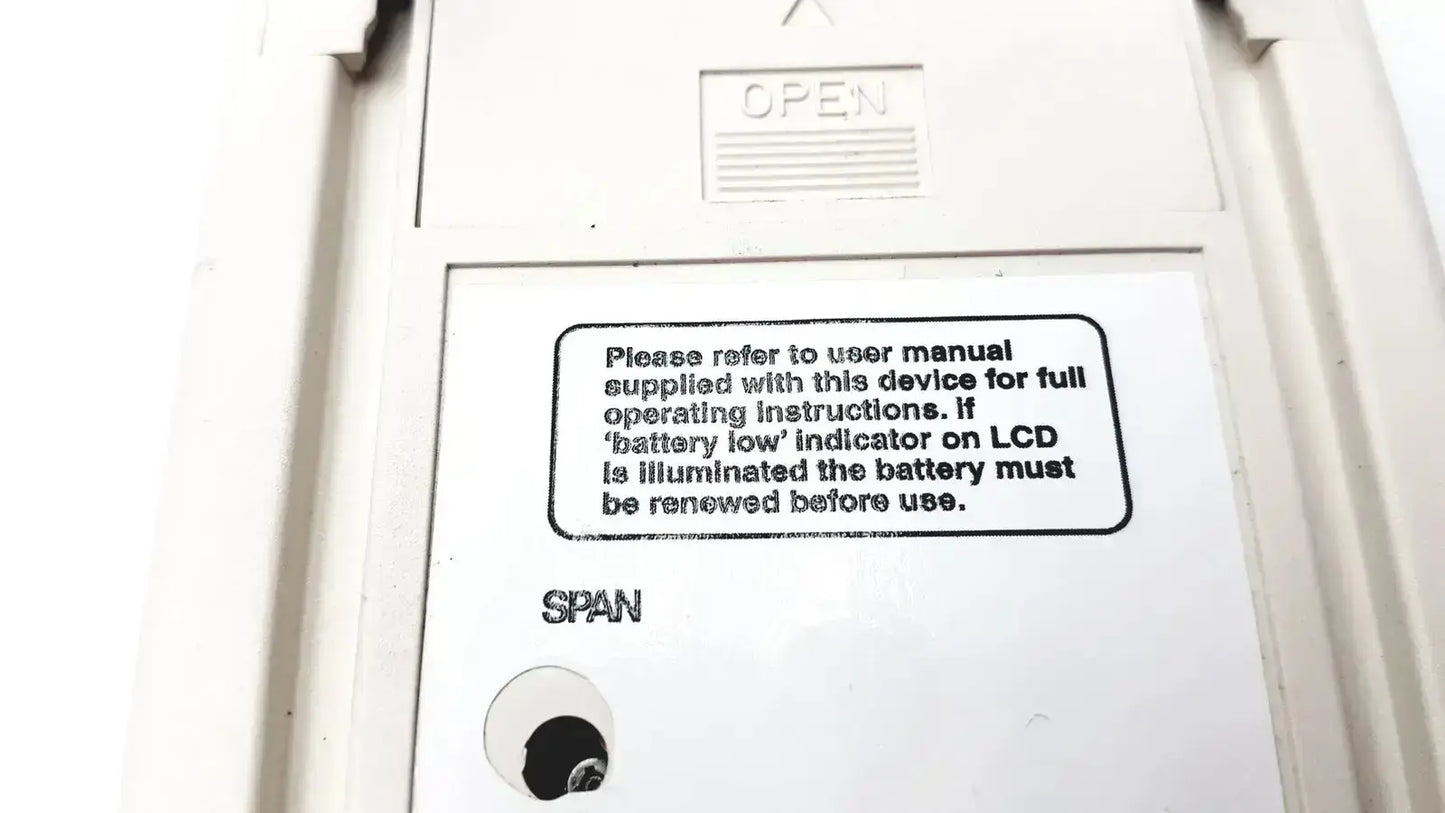 White plastic back panel of vitalograph breathco carbon monoxide monitor with open label and user instructions for smoking cessation