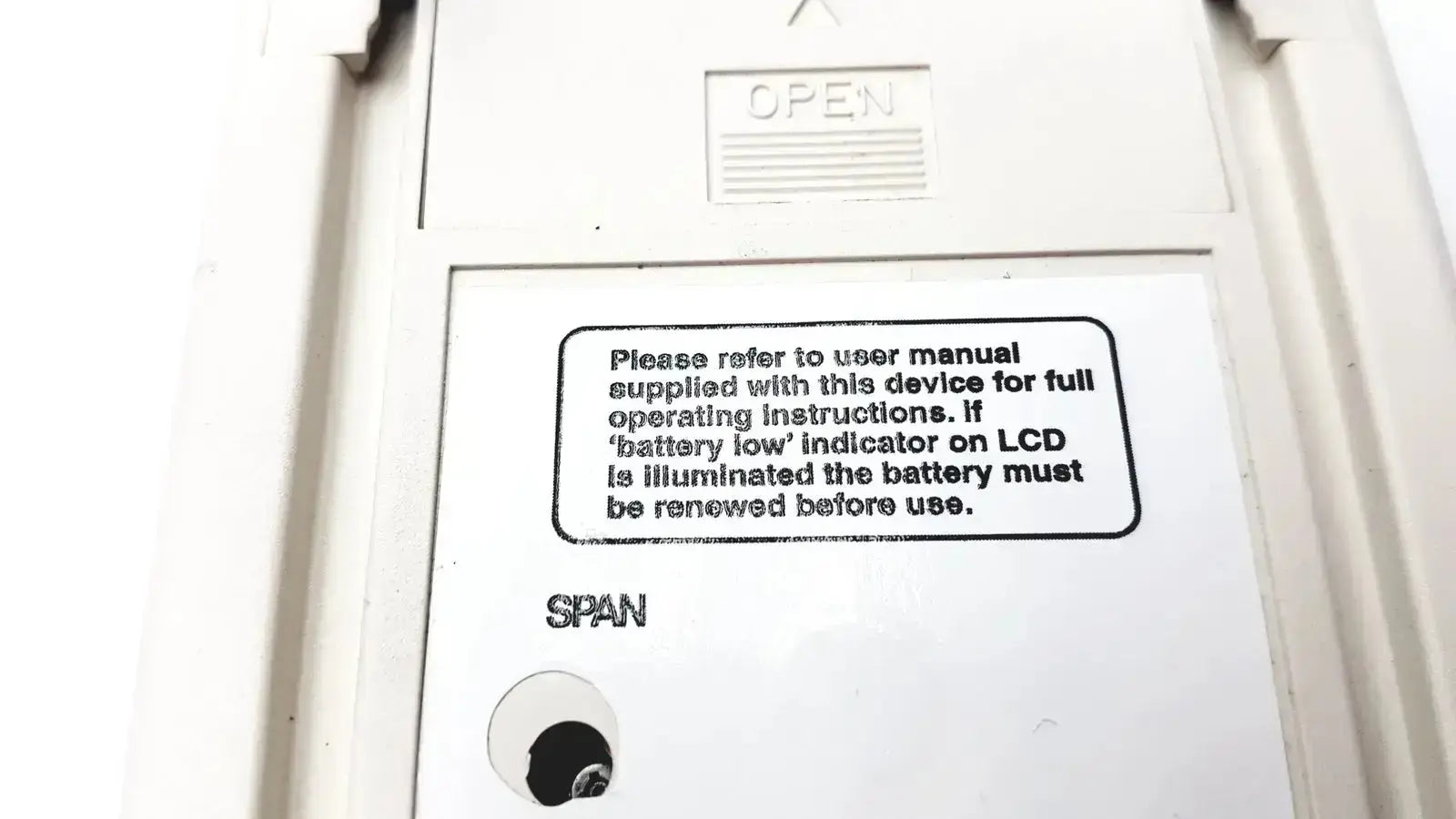 White plastic back panel of vitalograph breathco carbon monoxide monitor with open label and user instructions for smoking cessation