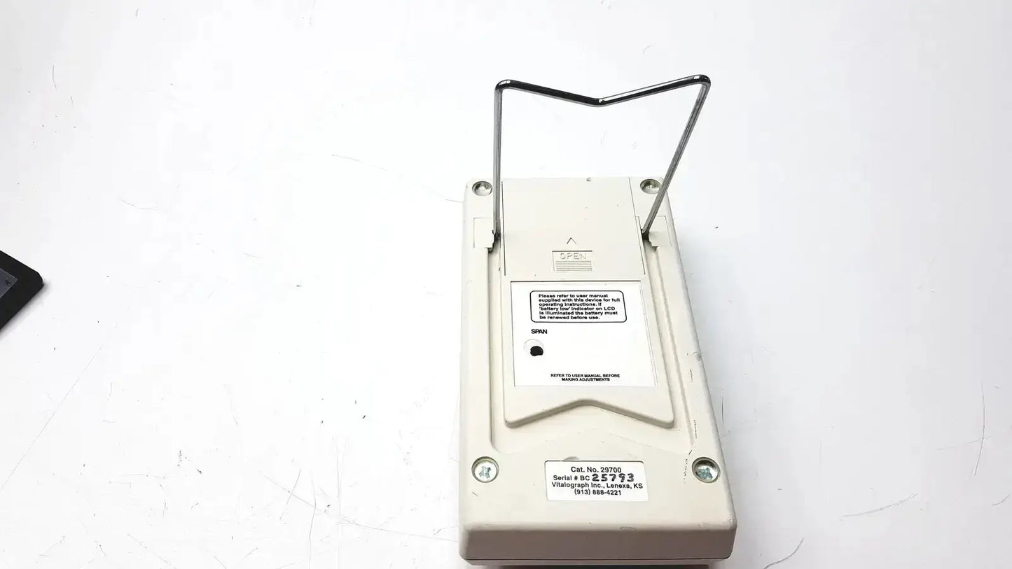 Beige plastic digital carbon monoxide monitor with metal stand vitalograph breathco for smoking cessation use