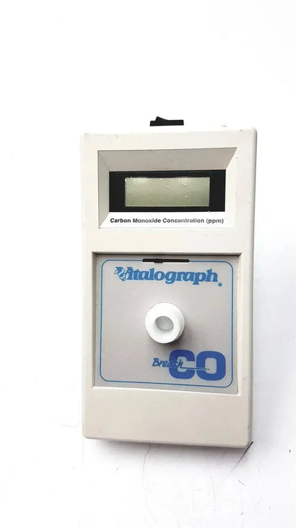 Beige rectangular vitalograph breathco carbon monoxide monitor with digital display for smoking cessation use