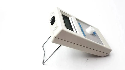 White plastic vitalograph breathco carbon monoxide monitor with digital display and black power switch for smoking cessation