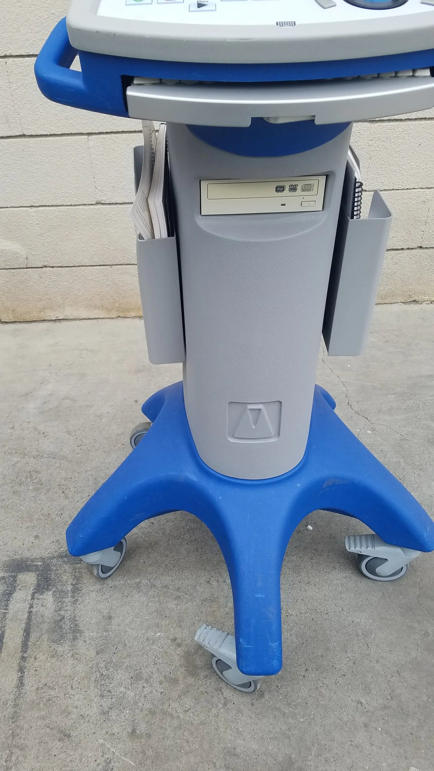Blue and gray mobile medical equipment ultrasound machine on wheeled stand for intravascular ultrasound reuse