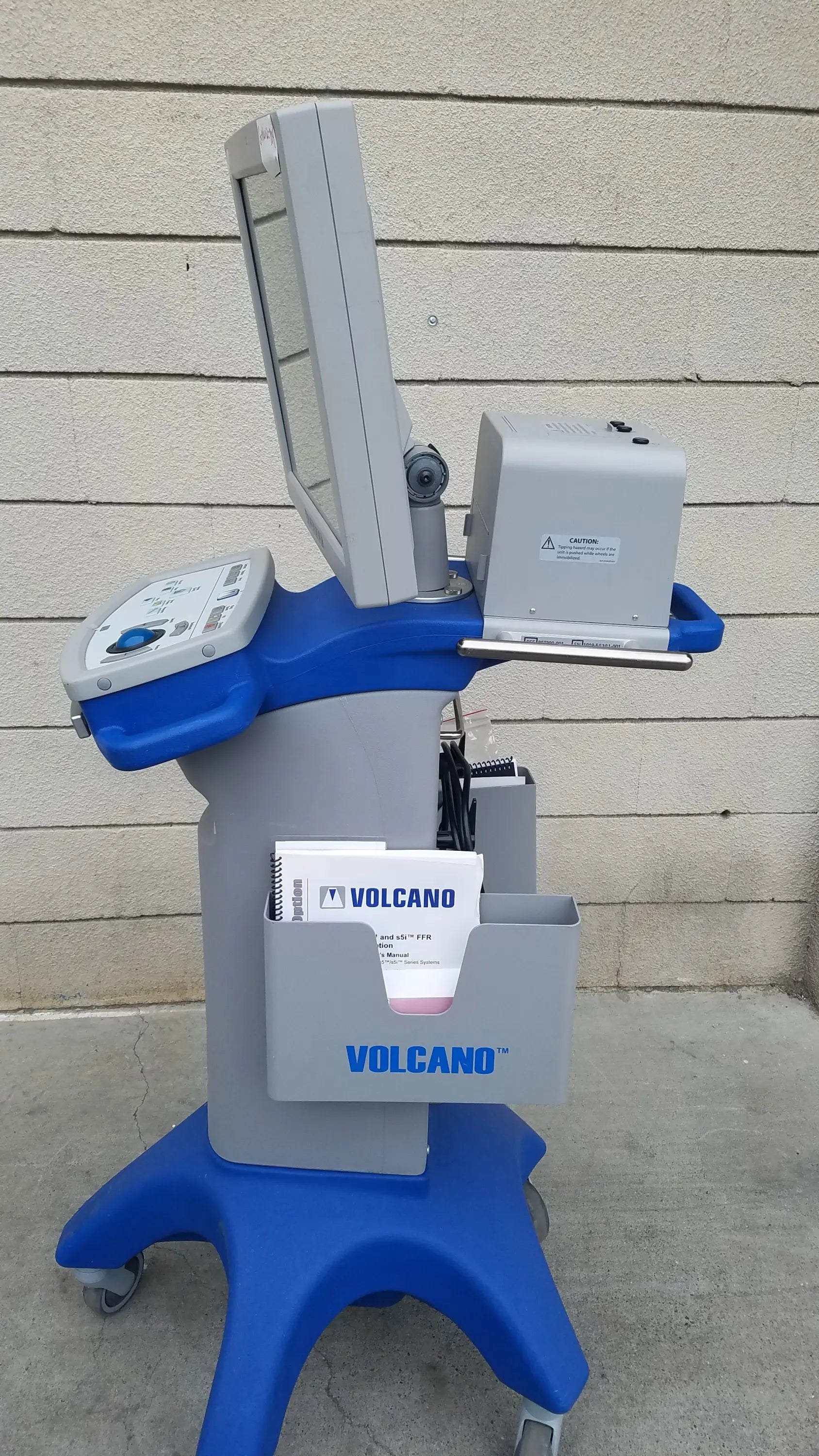 Blue and gray Volcano S5 intravascular ultrasound medical equipment cart with mounted monitor and control panel for reuse