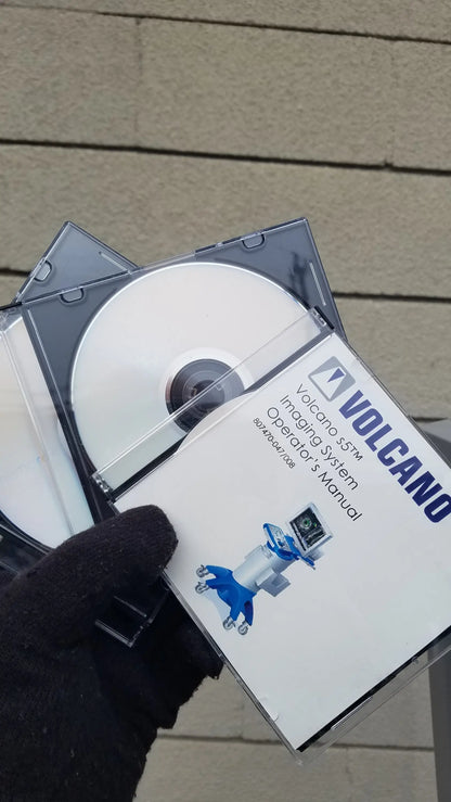 White and blue Volcano S5 intravascular ultrasound imaging system operator manual with clear plastic case holding two cds for reuse medical equipment