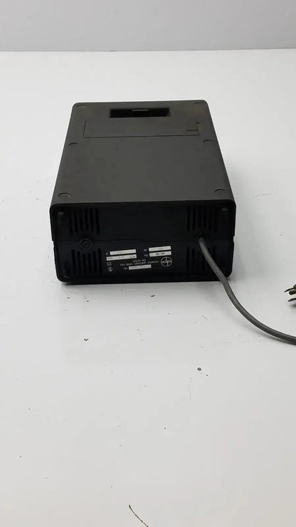 Black rectangular volpi intralux 6000 light source power supply unit with ventilation slots and gray cable 115v 185w