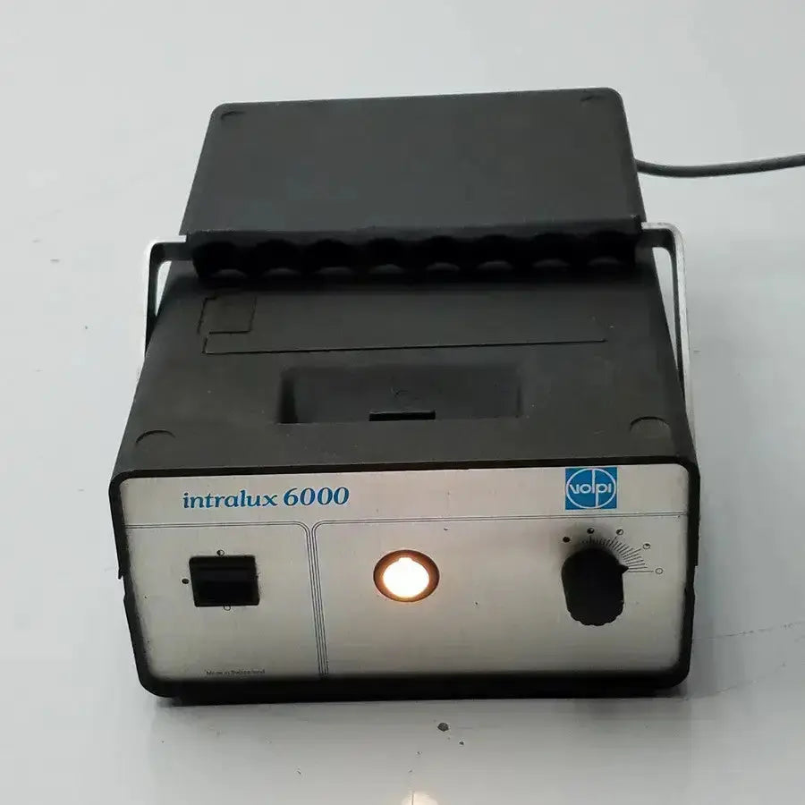 Black and silver volpi intralux 6000 light source 115v 185w dental curing light with illuminated circular lamp