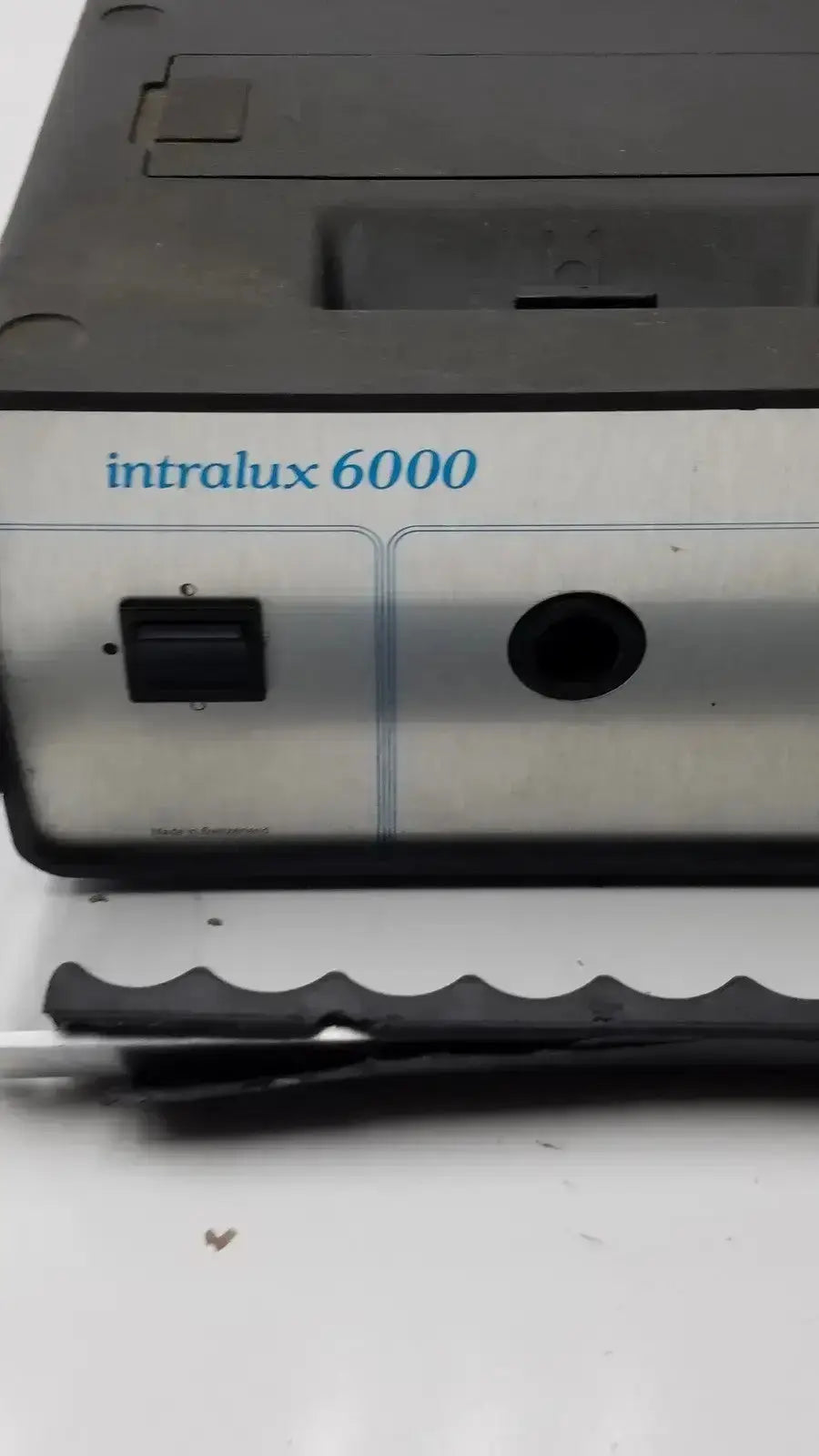 Silver and black volpi intralux 6000 light source with matte finish power switch and circular port 115v 185w