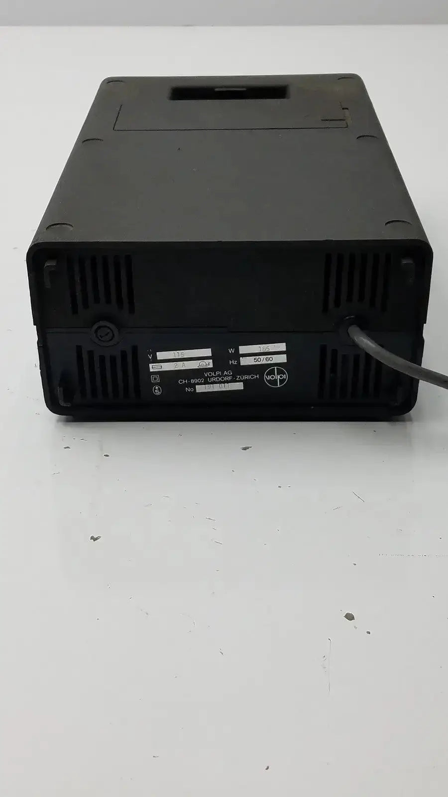 Black plastic volpi intralux light source power supply unit with ventilation, label showing 115v 185w voltage and frequency