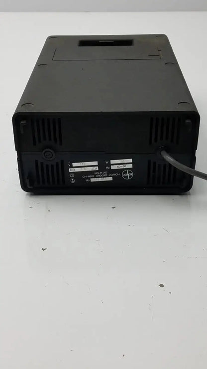 Black plastic volpi intralux light source power supply unit with ventilation, label showing 115v 185w voltage and frequency