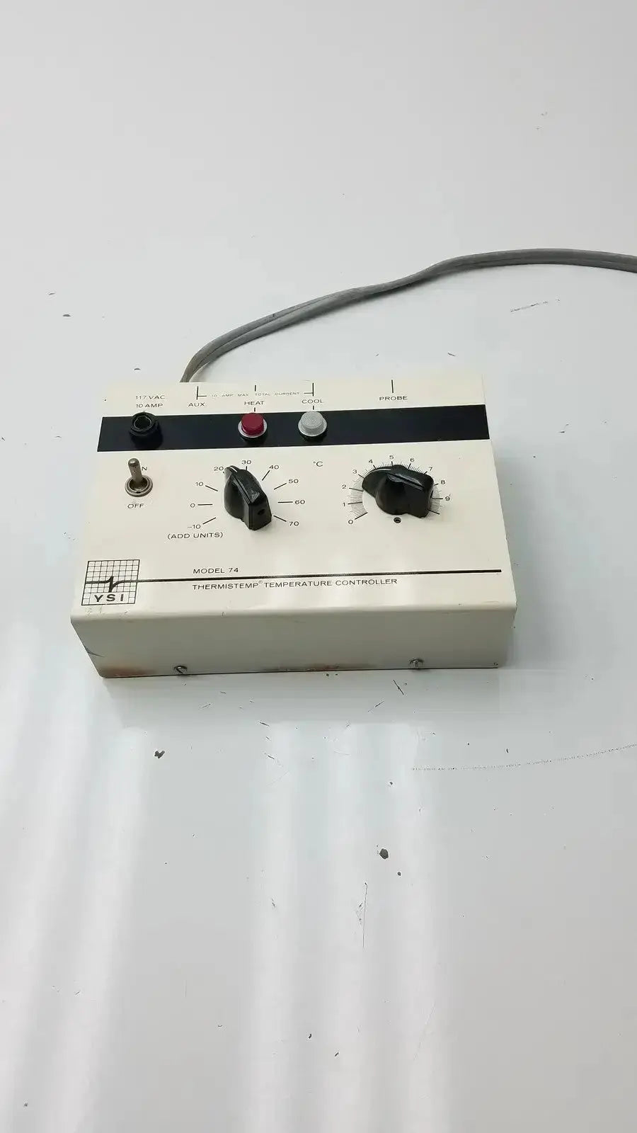White rectangular vsi thermistemp thermistemp temperature controller model 18 with black dials and switches on front panel