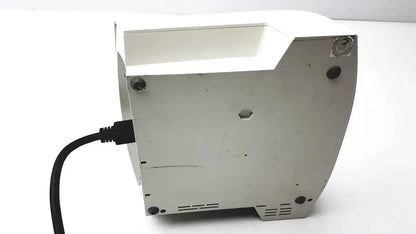 White plastic toaster with black power cord plugged in shown from the back side for astra tech handpiece unit use