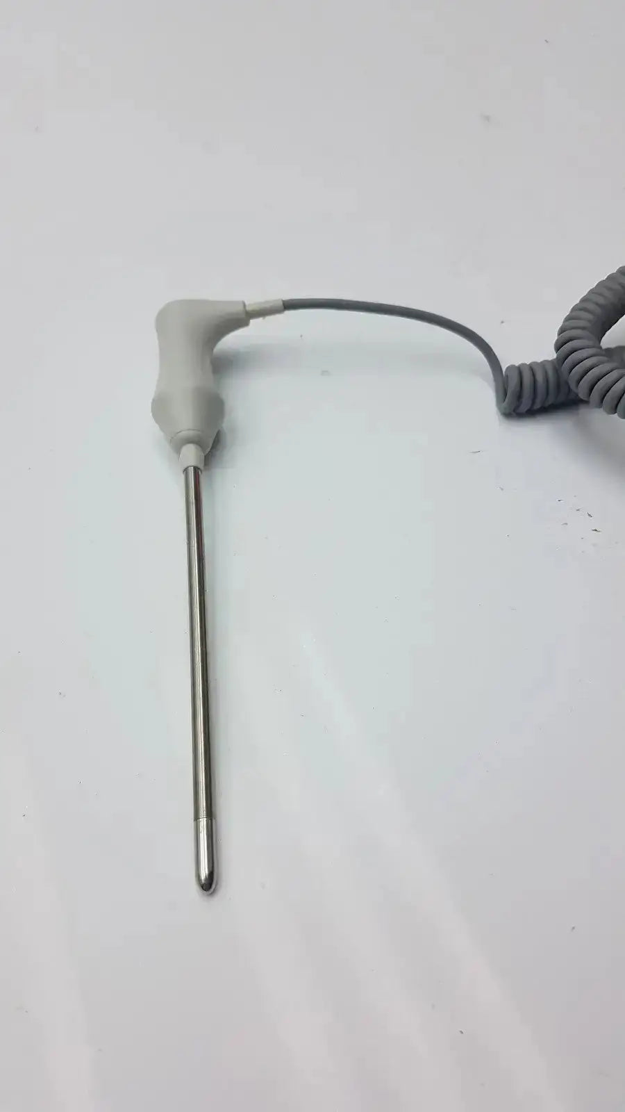 Gray coiled cable connected to a metallic probe with gray plastic housing for welch allyn oral temperature probe 02895-000
