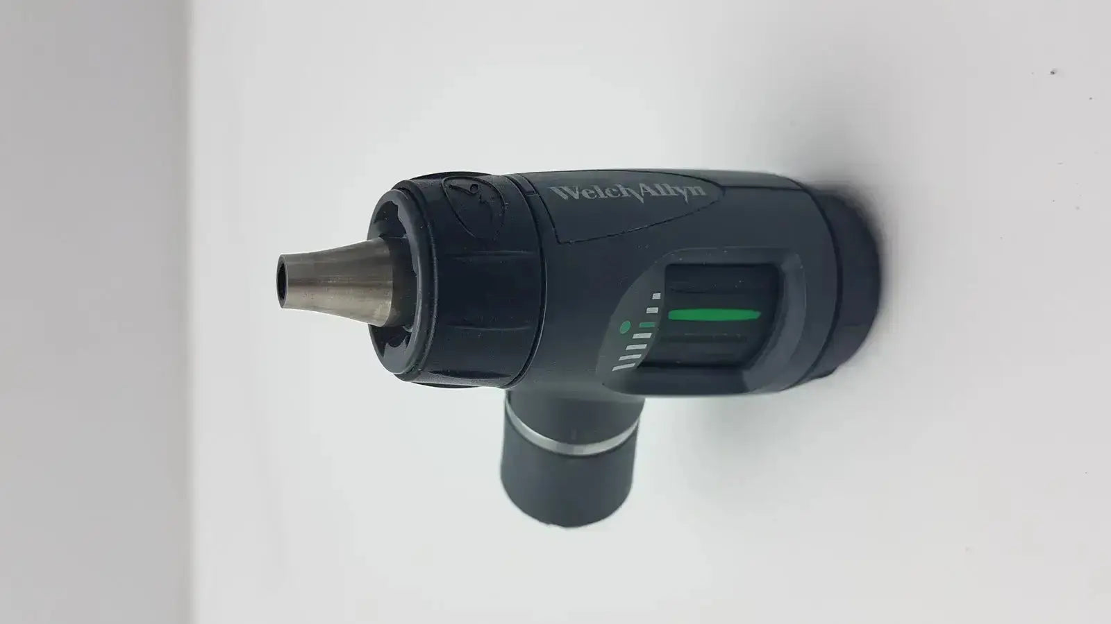Black welch allyn macroview otoscope head with metallic tip and green illuminated indicator for ear speculums use