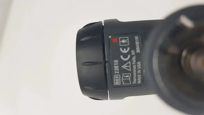 Black plastic flashlight head with textured grip and labeled specifications for welch allyn macroview otoscope ear speculums