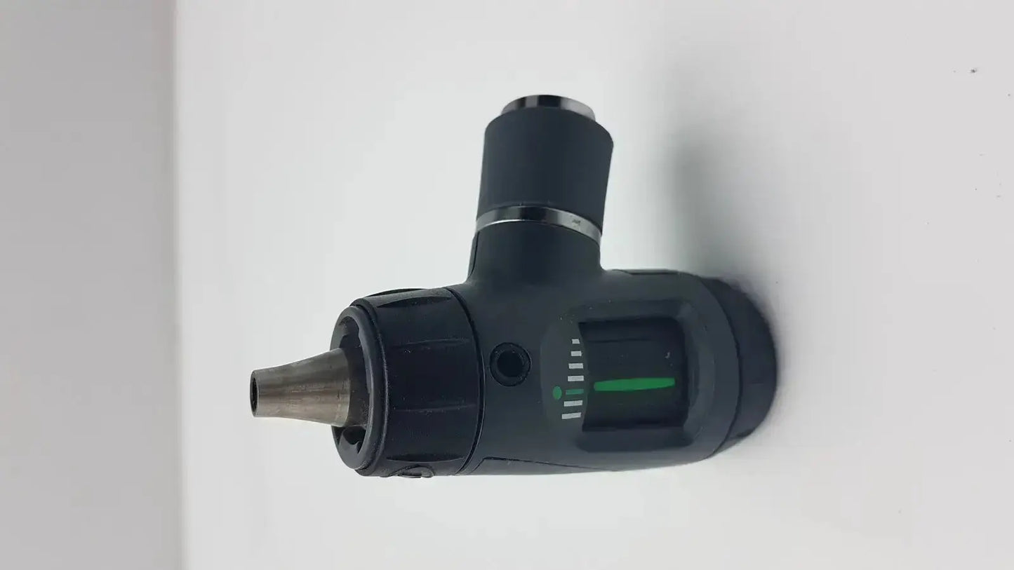 Black handheld welch allyn macroview otoscope head with metallic tip and green illuminated dial for ear speculums use