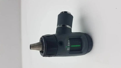 Black handheld welch allyn macroview otoscope head with metallic tip and green illuminated dial for ear speculums use