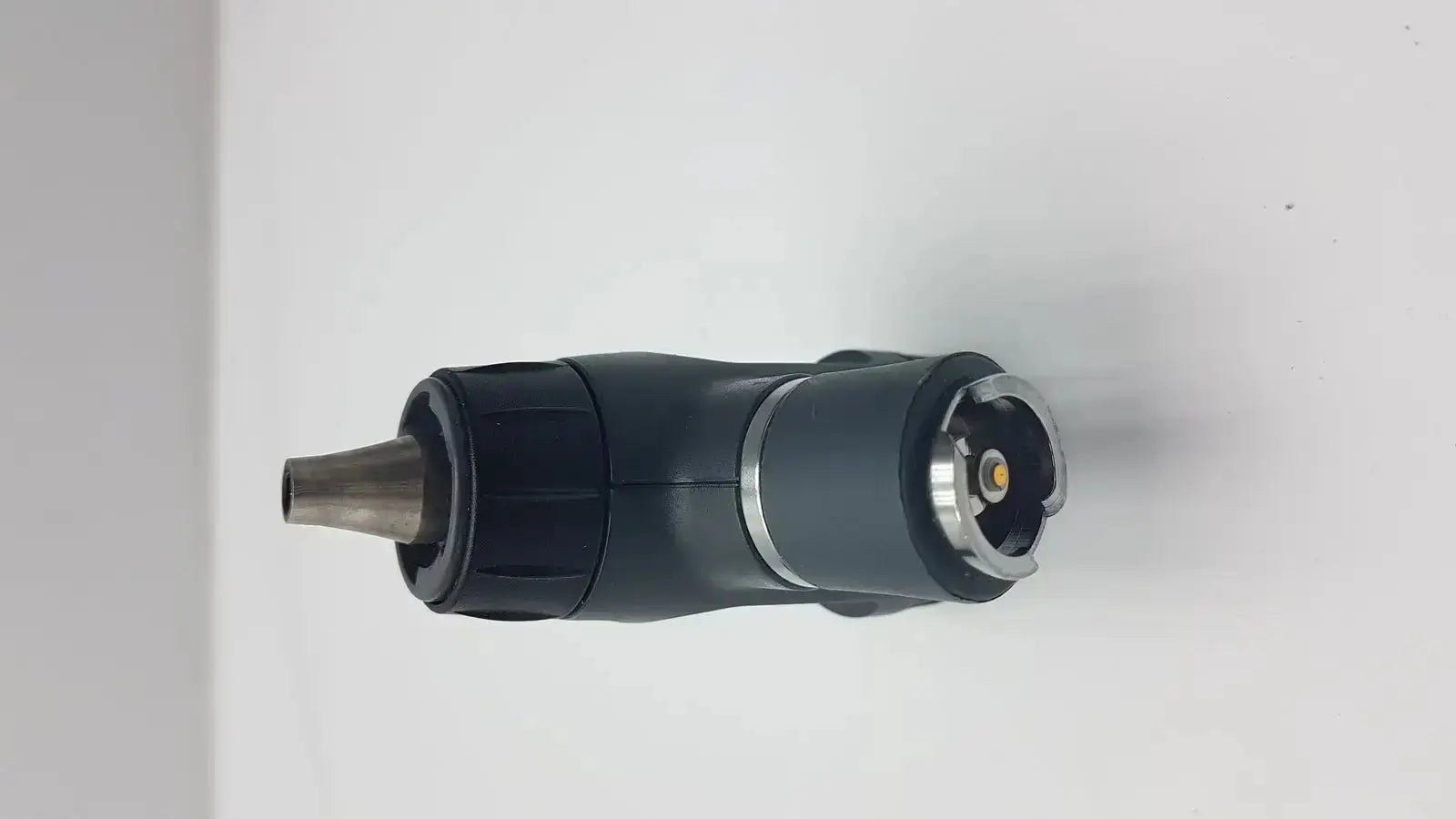 Black and silver handheld spray nozzle with textured grip and metallic tip for welch allyn macroview otoscope ear speculums