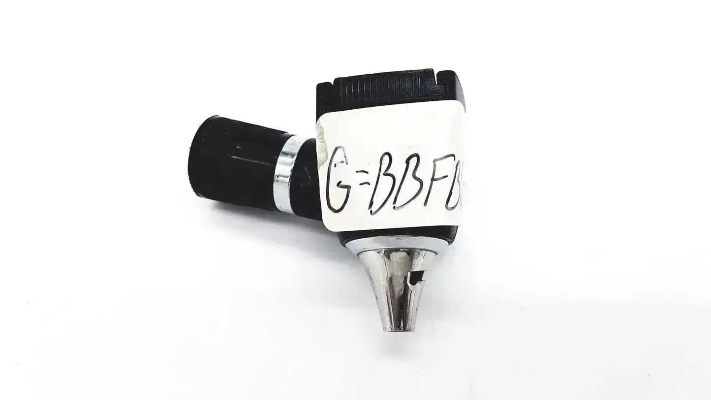 Black and silver Welch Allyn 25020 3.5V otoscope ophthalmoscope head with a handwritten label shown clearly