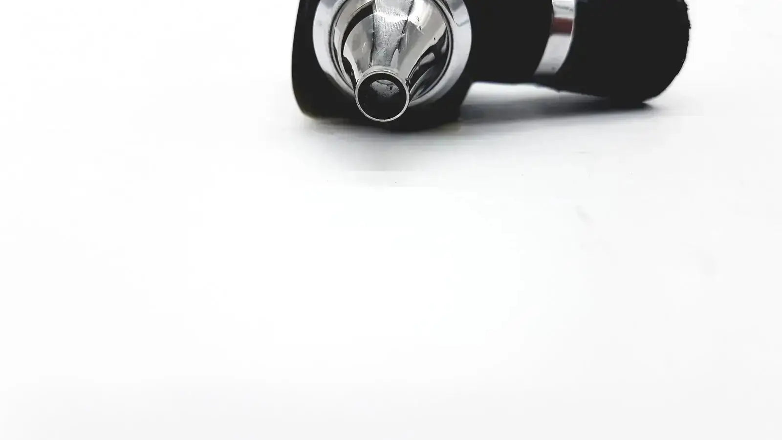 Black and silver Welch Allyn 25020 3.5V otoscope ophthalmoscope head with metallic mouthpiece for medical use