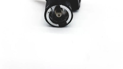Black cylindrical Welch Allyn 25020 3.5V otoscope ophthalmoscope head with textured grip and metallic internal components