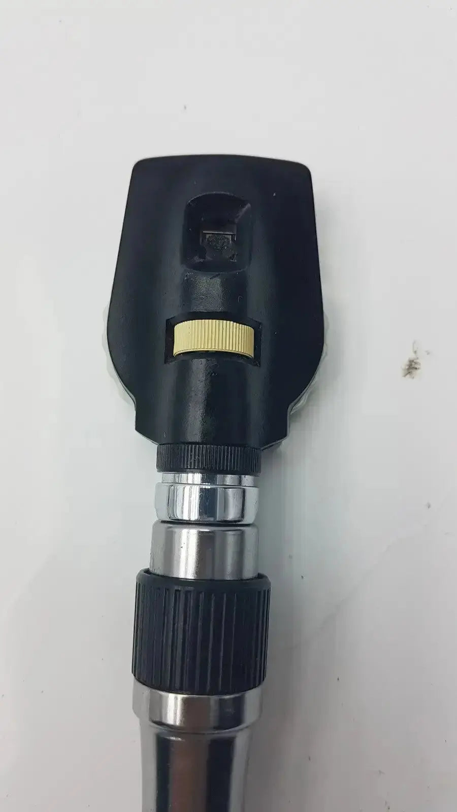 Welch Allyn 3.5V ophthalmoscope head in black and silver with yellow adjustment ring for hospital surplus use