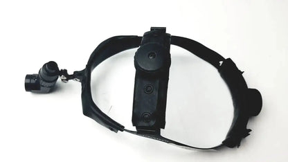 Black welch allyn surgical headlight assy with adjustable strap and articulated arm for precise illumination