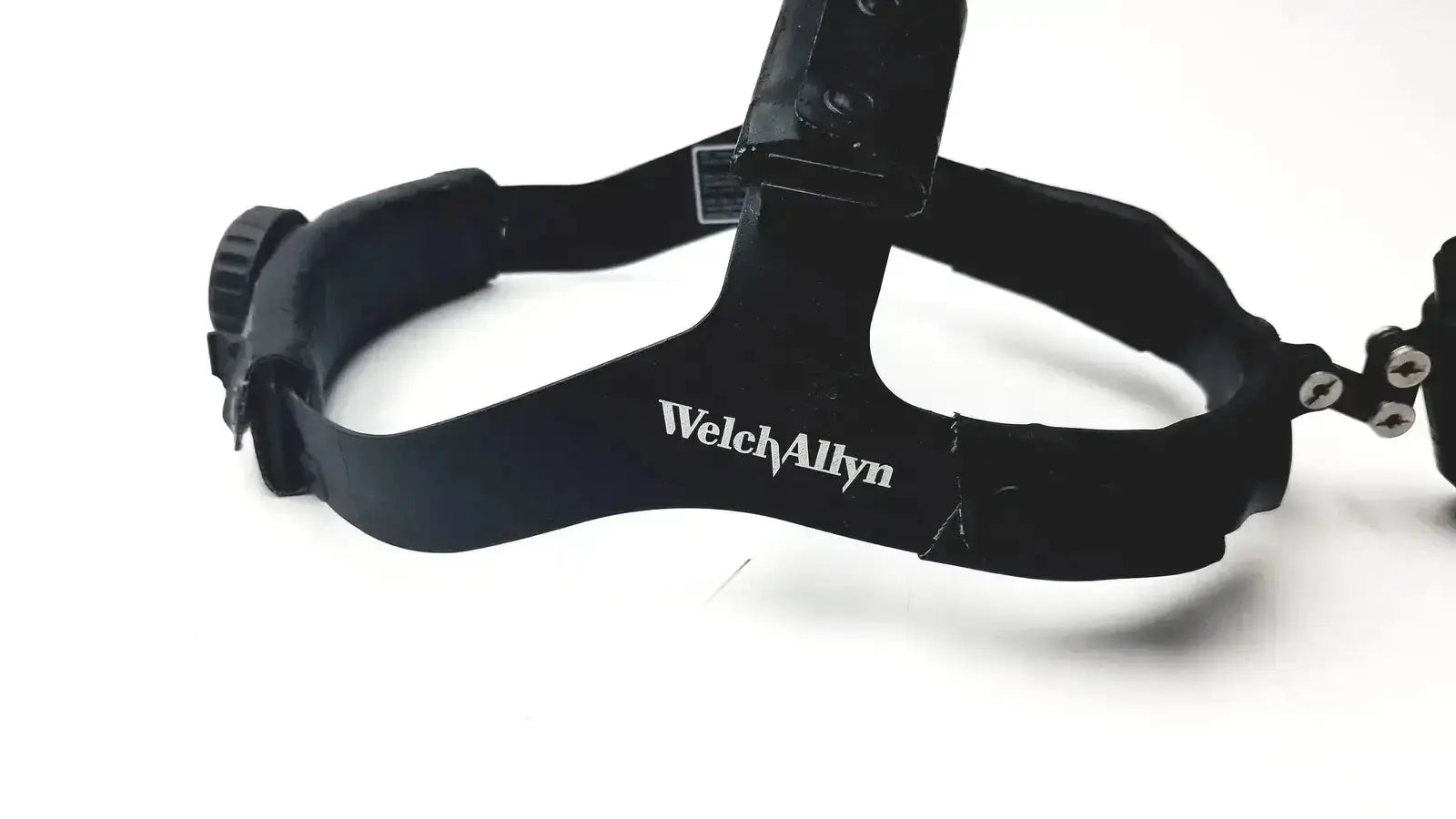 Black welch allyn surgical headlight assy with adjustable straps and central mounting bracket for medical use