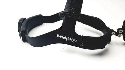 Black welch allyn surgical headlight assy with adjustable straps and central mounting bracket for medical use