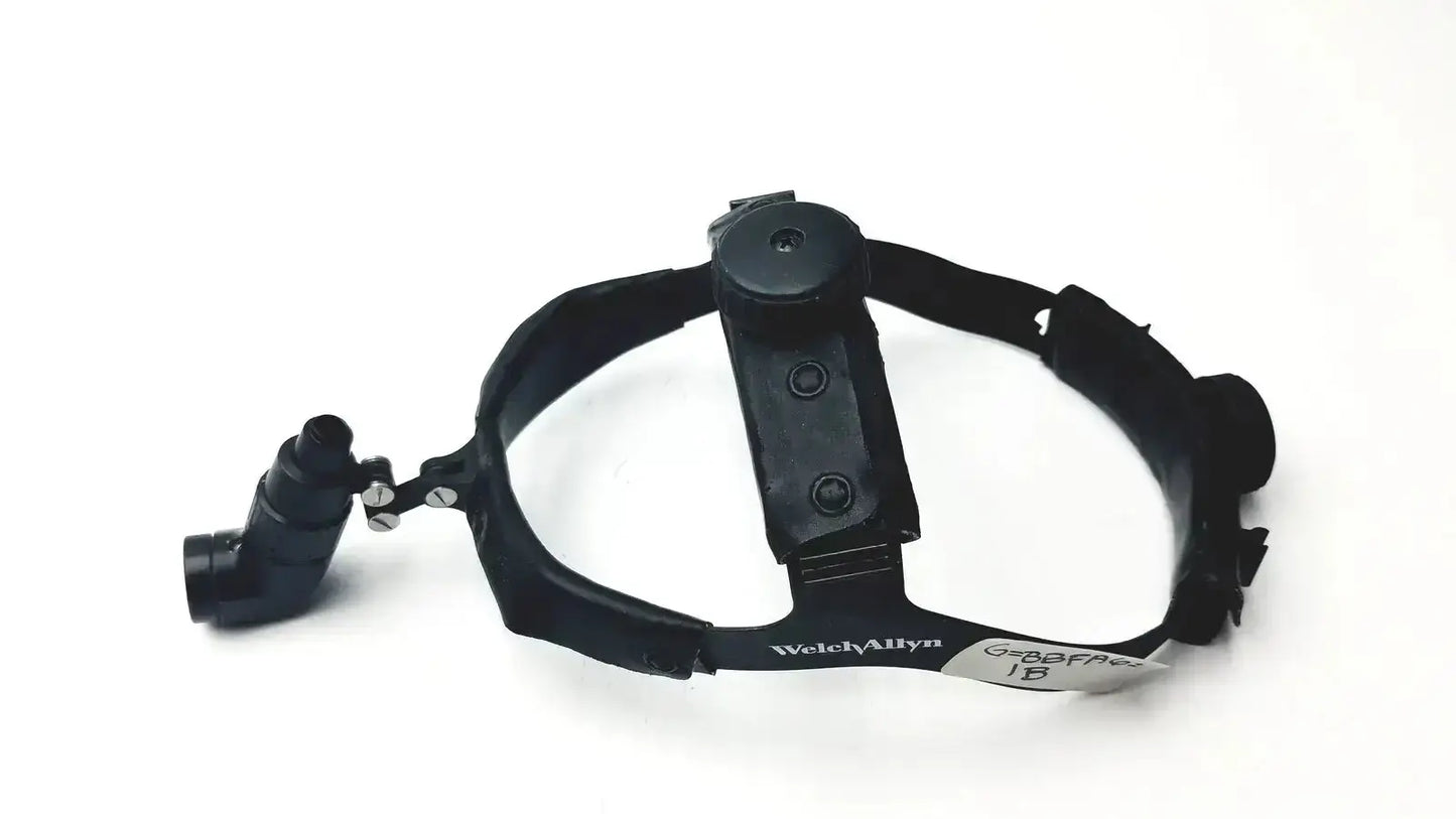Black head-mounted welch allyn surgical headlight assy with adjustable arm and branded strap for medical use