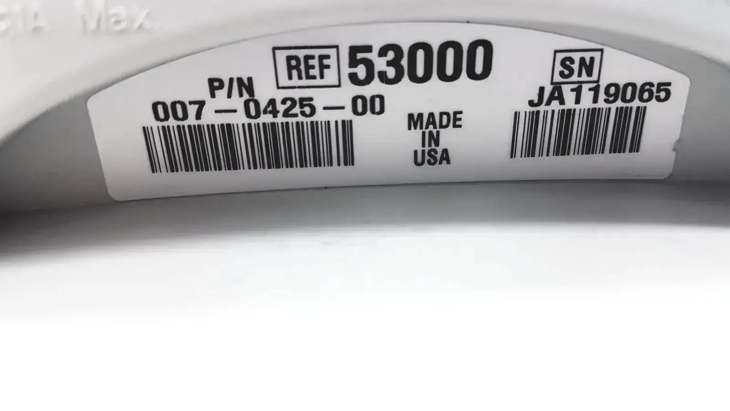 White plastic label with black text and barcodes on the back of a welch allyn 53000 series vital signs monitor