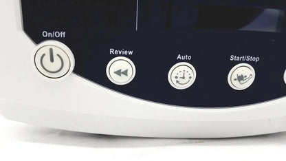 White plastic control panel with four circular buttons on/off review auto and start stop on welch allyn 53000 series vital signs monitor against dark navy background