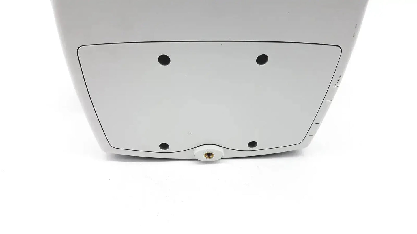 White plastic back side of welch allyn 53000 series vital signs monitor with four black circular indentations and central screw