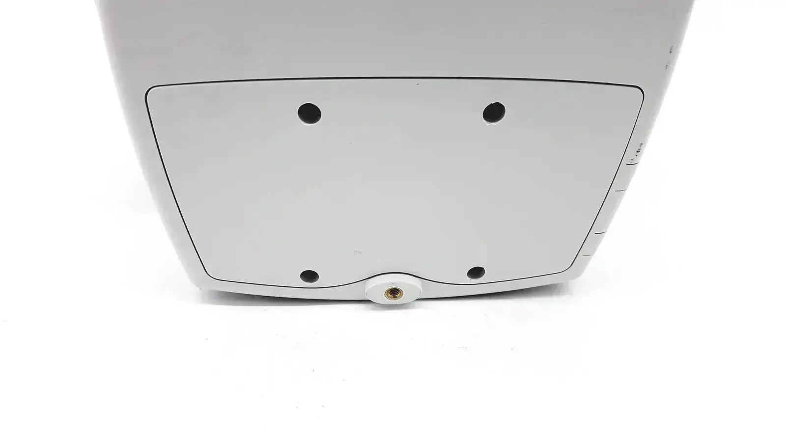 White plastic back side of welch allyn 53000 series vital signs monitor with four black circular indentations and central screw