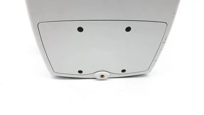 White plastic back side of welch allyn 53000 series vital signs monitor with four black circular indentations and central screw