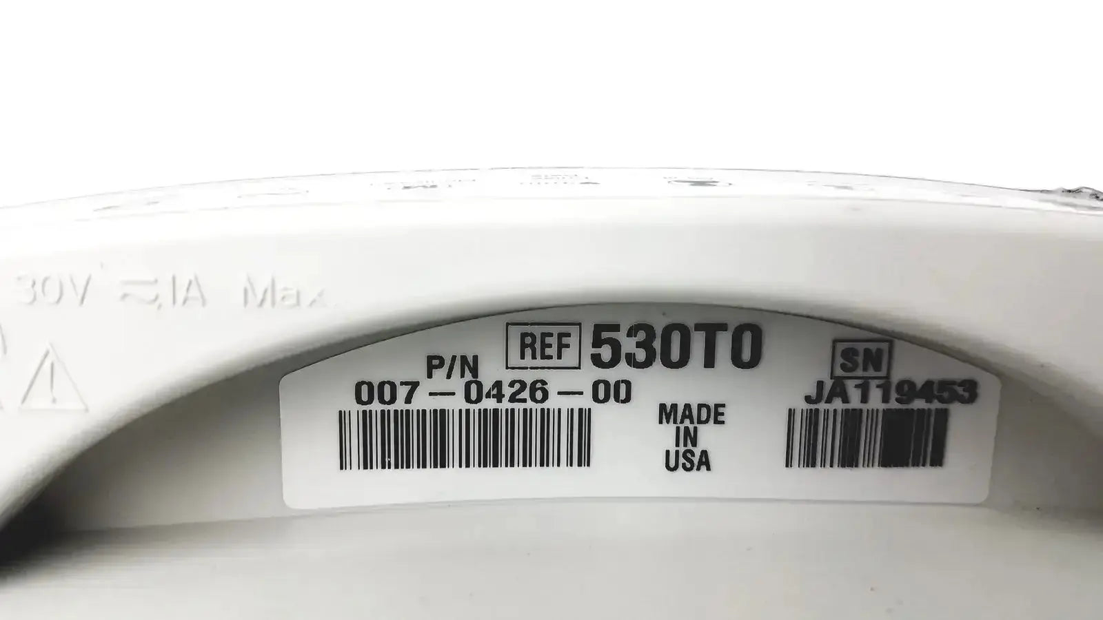 White plastic electrical component with molded label showing part number 530to on the welch allyn 530t0 patient monitor