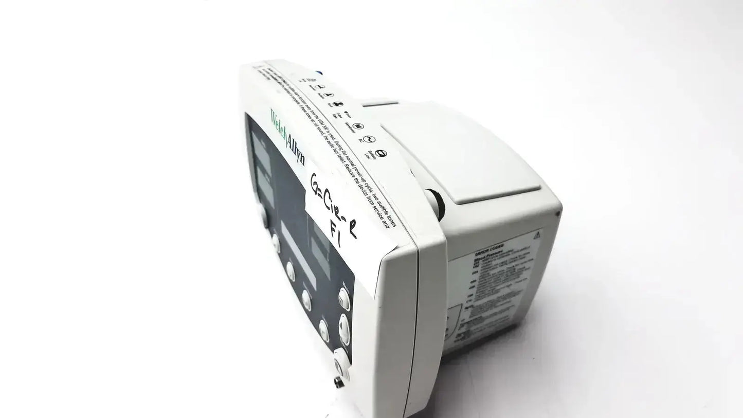 White welch allyn 530t0 patient monitor with black screen and control buttons labeled nellcor on its side