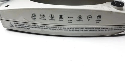 White plastic welch allyn 530t0 patient monitor with black knobs and labeled icons for pulse rate and power status