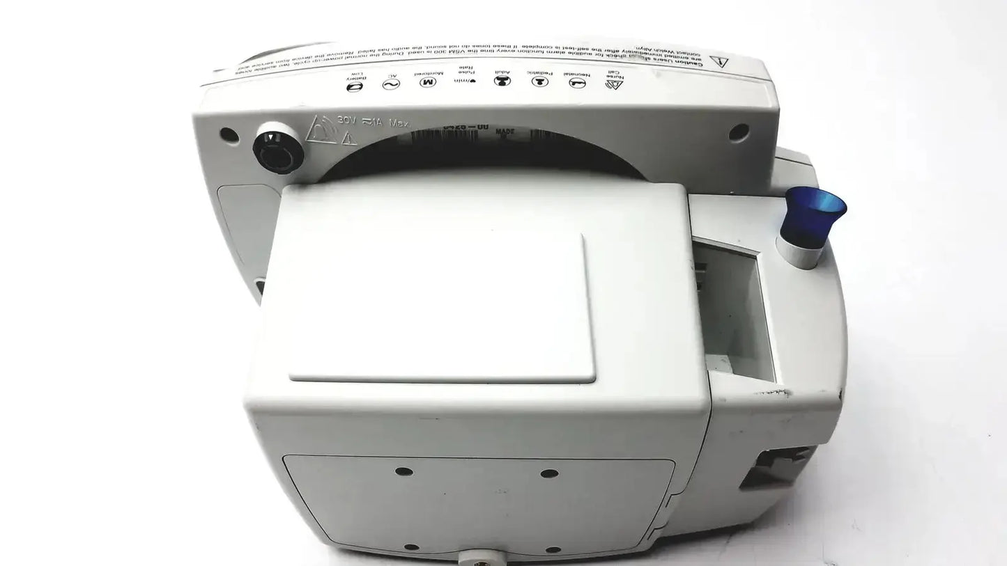 Gray welch allyn 530t0 patient monitor with blue cap side and control buttons along top edge for medical use