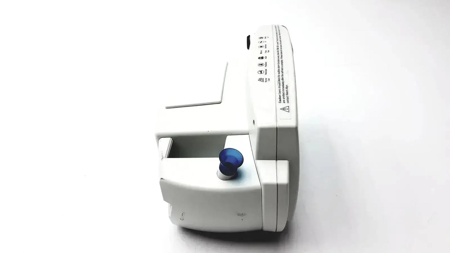 White welch allyn 530t0 patient monitor with blue circular knob and printed labels on its side for medical use