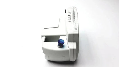 White welch allyn 530t0 patient monitor with blue circular knob and printed labels on its side for medical use