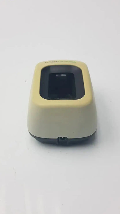 Beige and black handheld barcode scanner with rectangular window compatible with welch allyn series charger used medical equipment for sale