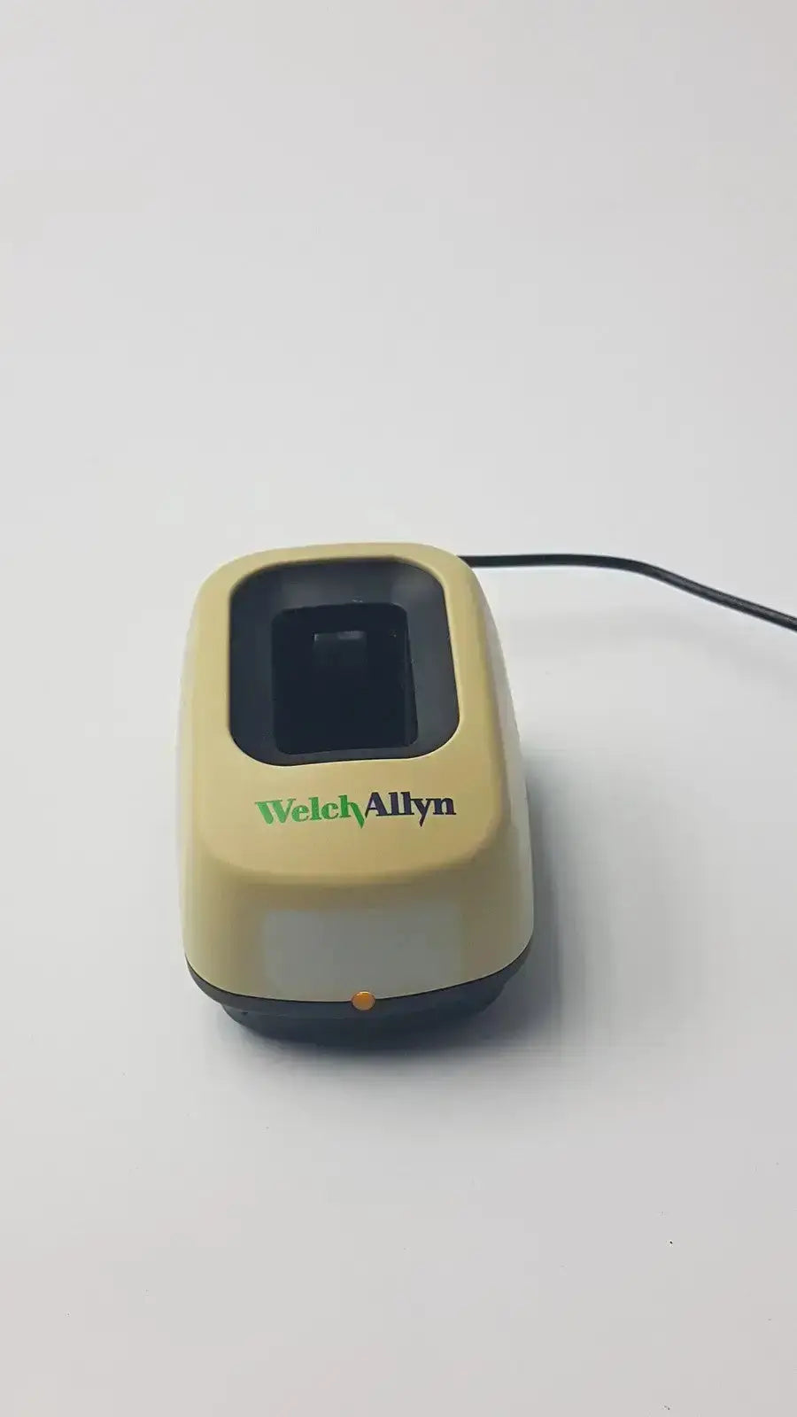 Beige welch allyn 739 series charger with black fingerprint scanner window and dark gray base for used medical equipment sale